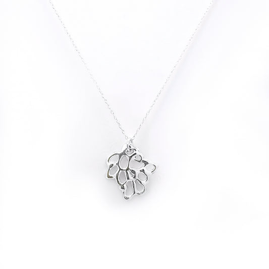 Presenting the Maple Necklace from FR | Art Jewellery, a delicate gold-plated sterling silver piece featuring a fine chain adorned with a hollow geometric pendant. The pendant showcases an abstract, interconnected pattern that adds an elegant touch to its minimalist design. Photographed against a pure white background, the intricate details of this handmade jewellery are beautifully emphasized.