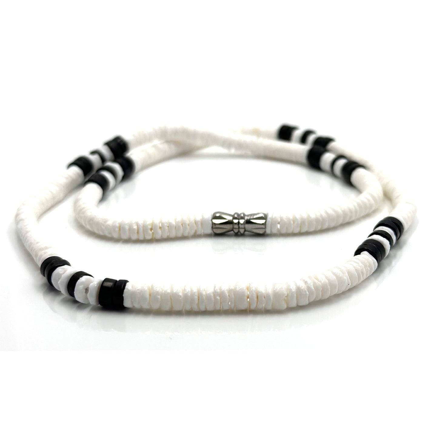 The White and Black Beaded Necklace by FR | Art Jewellery (Thamus Design) features monochrome shell beads with black accents and a silver cylindrical clasp, shown coiled on a white background.