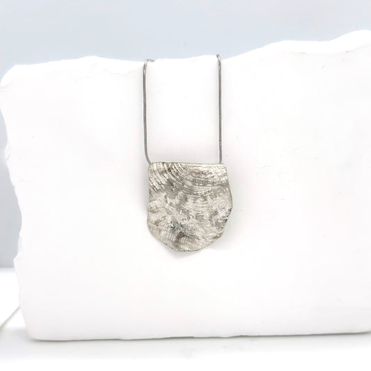 Handmade sterling silver organic pendant necklace with sculptural textured surface by FR Art Jewellery rock