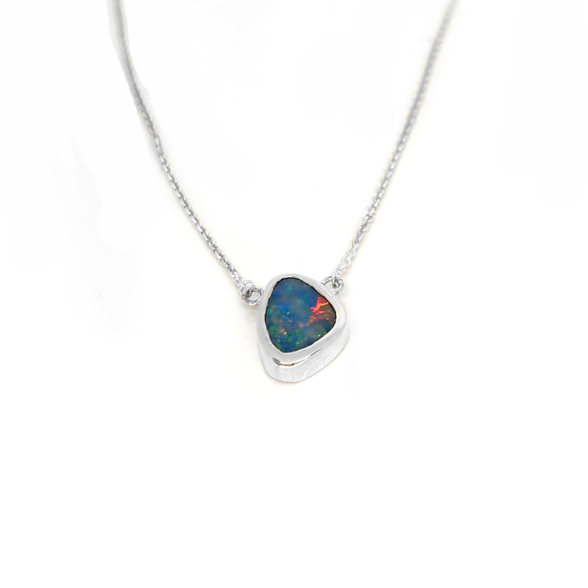 Handmade sterling silver necklace featuring a freeform Australian opal with vibrant blue and red tones, designed by FR Art Jewellery.