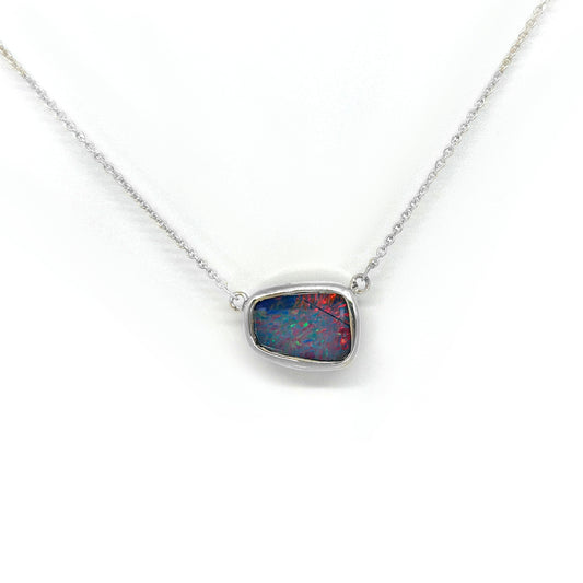 Handmade sterling silver necklace featuring a freeform Australian opal with vibrant blue and red tones, designed by FR Art Jewellery.