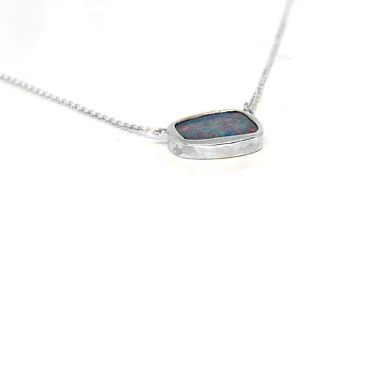 Handmade sterling silver necklace featuring a freeform Australian opal with vibrant blue and red tones, designed by FR Art Jewellery.