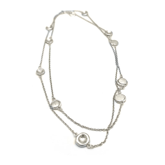 The Pebble Sterling Silver Necklace by FR | Art Jewellery is a handmade contemporary piece featuring evenly spaced circular pendants with clear stones, shown on a white background—crafted in Australia with minimalist elegance.