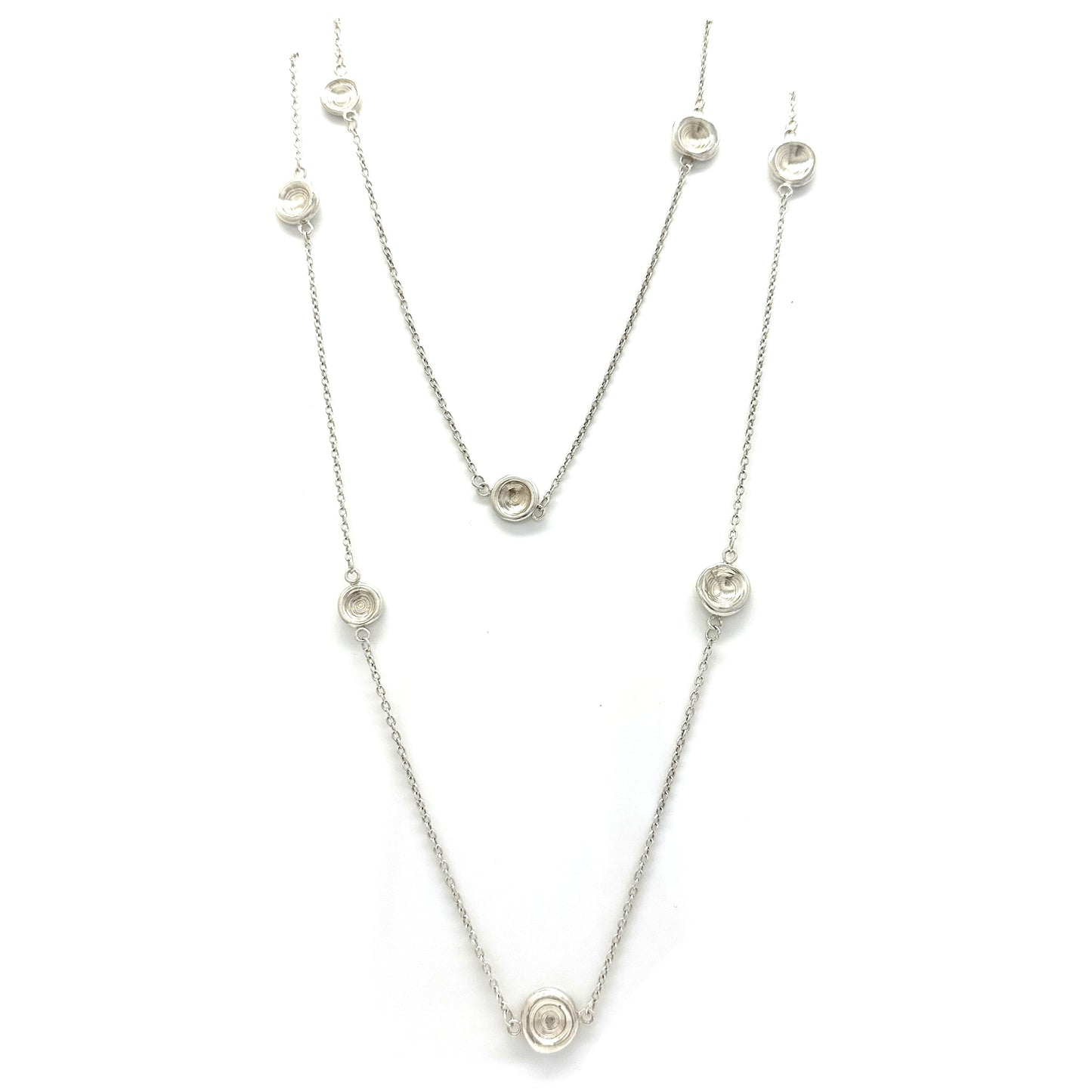 The Pebble Sterling Silver Necklace by FR | Art Jewellery is a handmade contemporary piece featuring evenly spaced circular pendants with clear stones, shown on a white background—crafted in Australia with minimalist elegance.