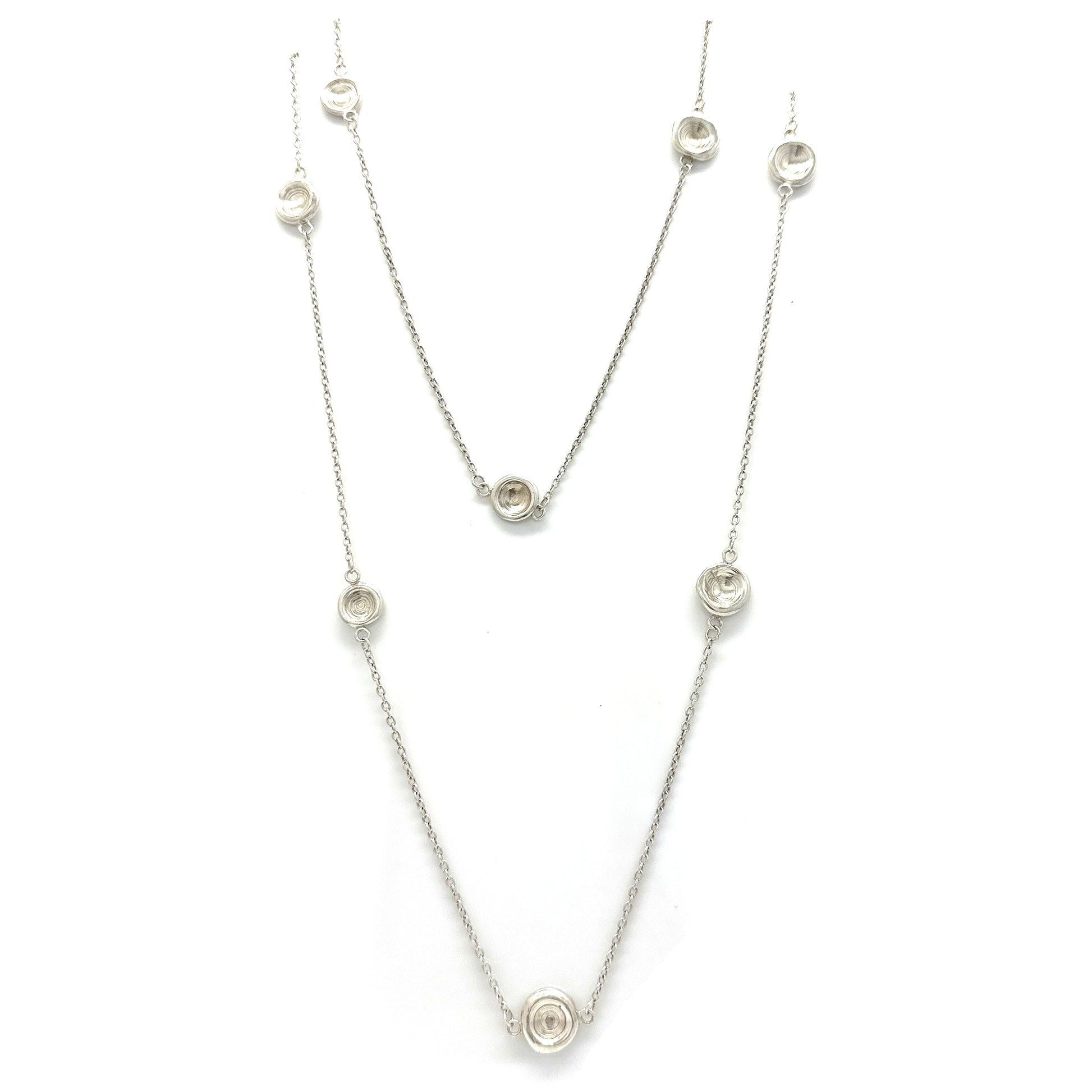 The Pebble Sterling Silver Necklace by FR | Art Jewellery is a handmade contemporary piece featuring evenly spaced circular pendants with clear stones, shown on a white background—crafted in Australia with minimalist elegance.