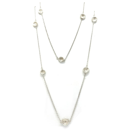 The Pebble Sterling Silver Necklace by FR | Art Jewellery is a handmade contemporary piece featuring evenly spaced circular pendants with clear stones, shown on a white background—crafted in Australia with minimalist elegance.