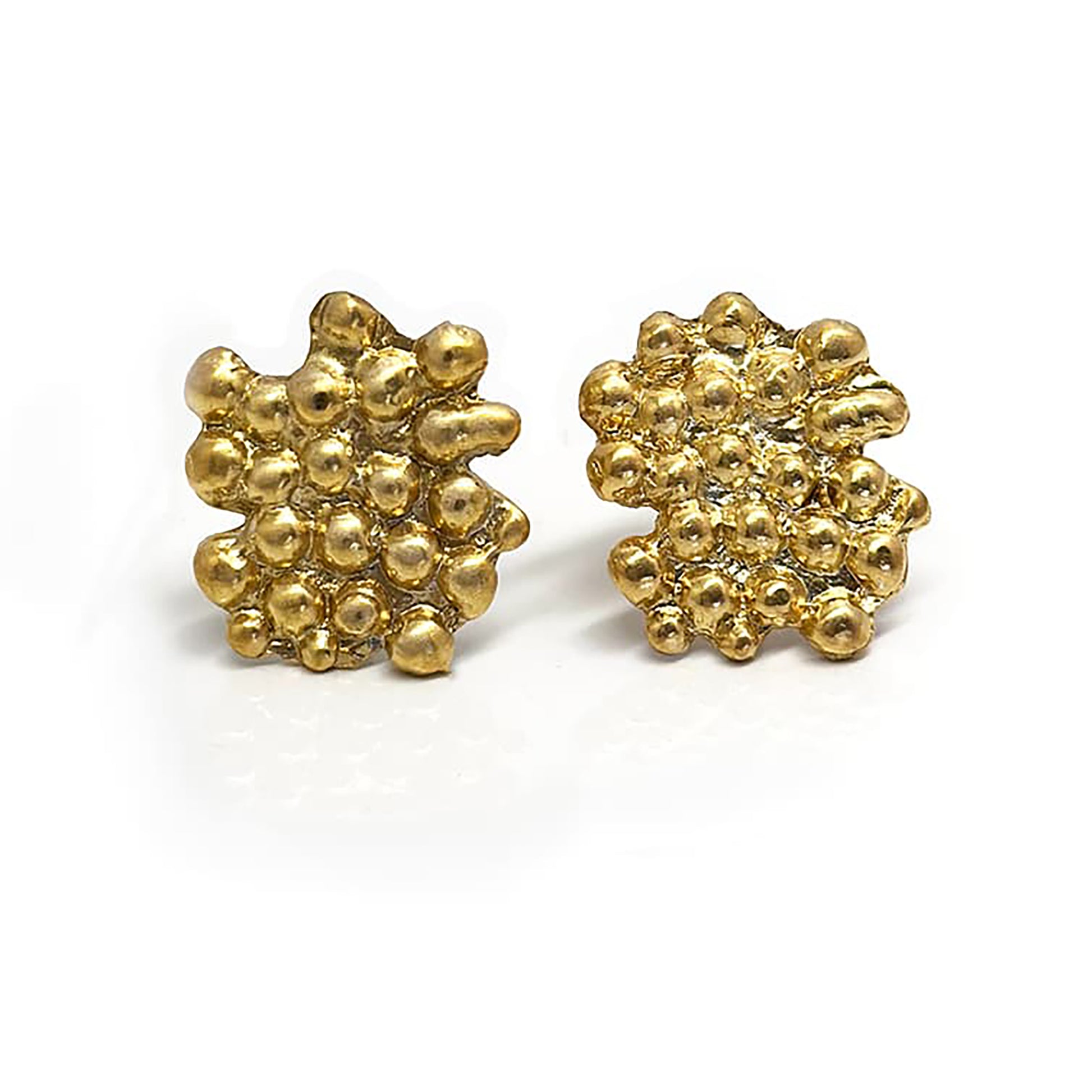 A pair of Perlas Earrings in Sterling Silver by FR | Art Jewellery features a textured, irregular cluster design of small rounded bumps—one earring faces forward, the other shows the side and post, perfect for lovers of unique style.