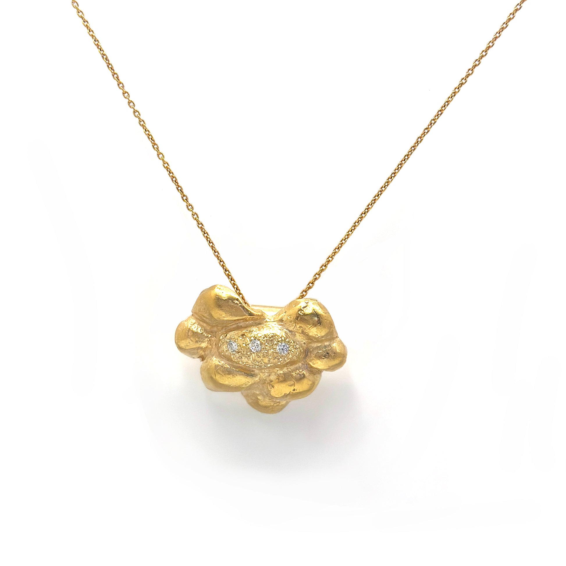 Gold-plated sterling silver pendant with textured pine-inspired sculptural form and natural diamonds set in the centre — handcrafted necklace by FR Art Jewellery.
