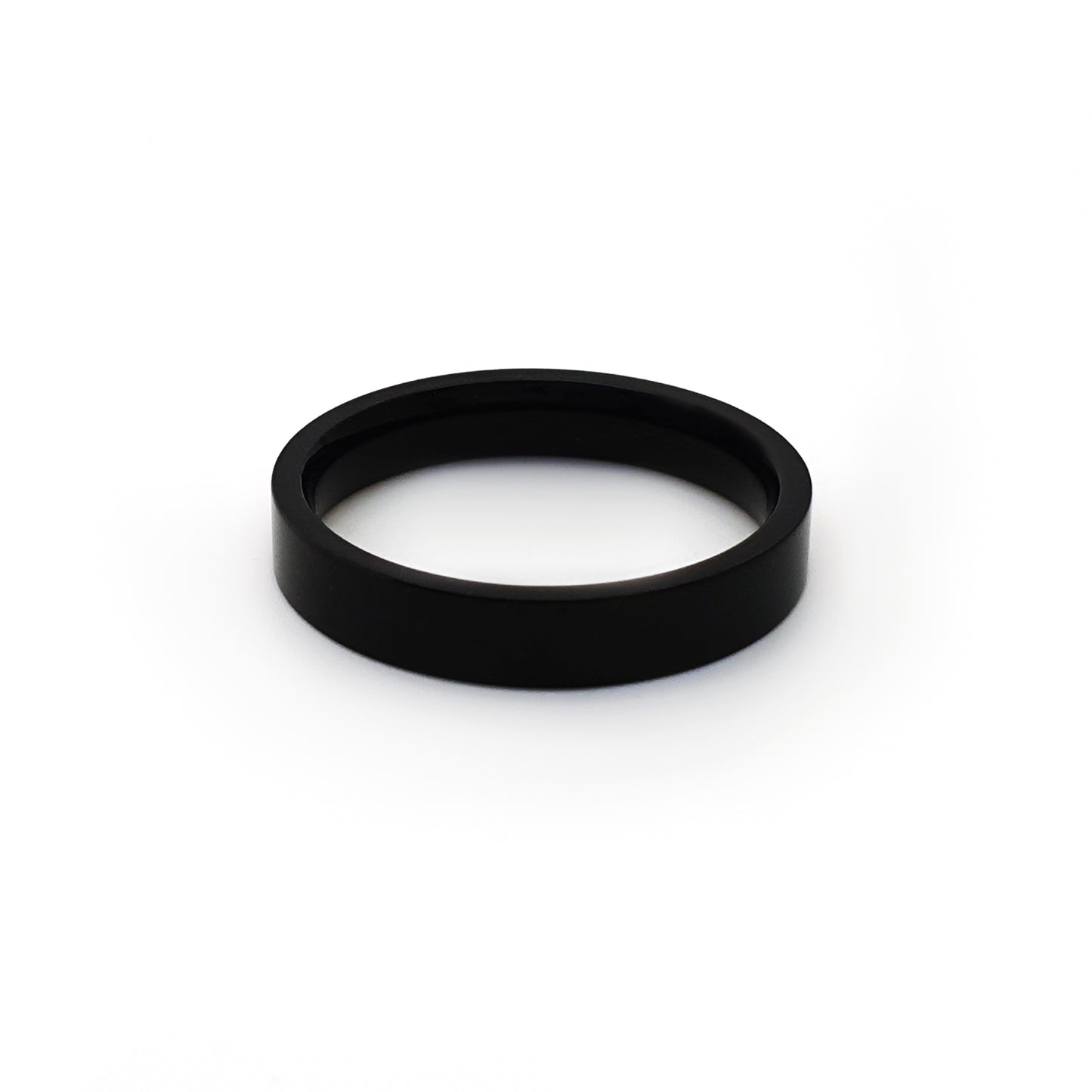 The FR | Art Jewellery Stainless Steel Black 4mm ring features a smooth, polished black finish and a comfortable fit, shown upright against a white background.