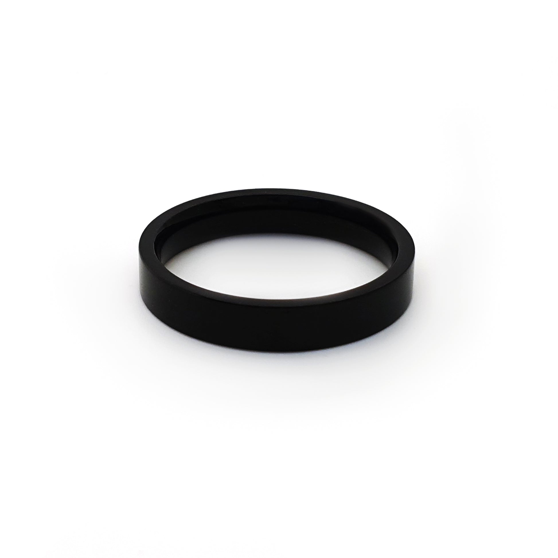 The FR | Art Jewellery Stainless Steel Black 4mm ring features a smooth, polished black finish and a comfortable fit, shown upright against a white background.