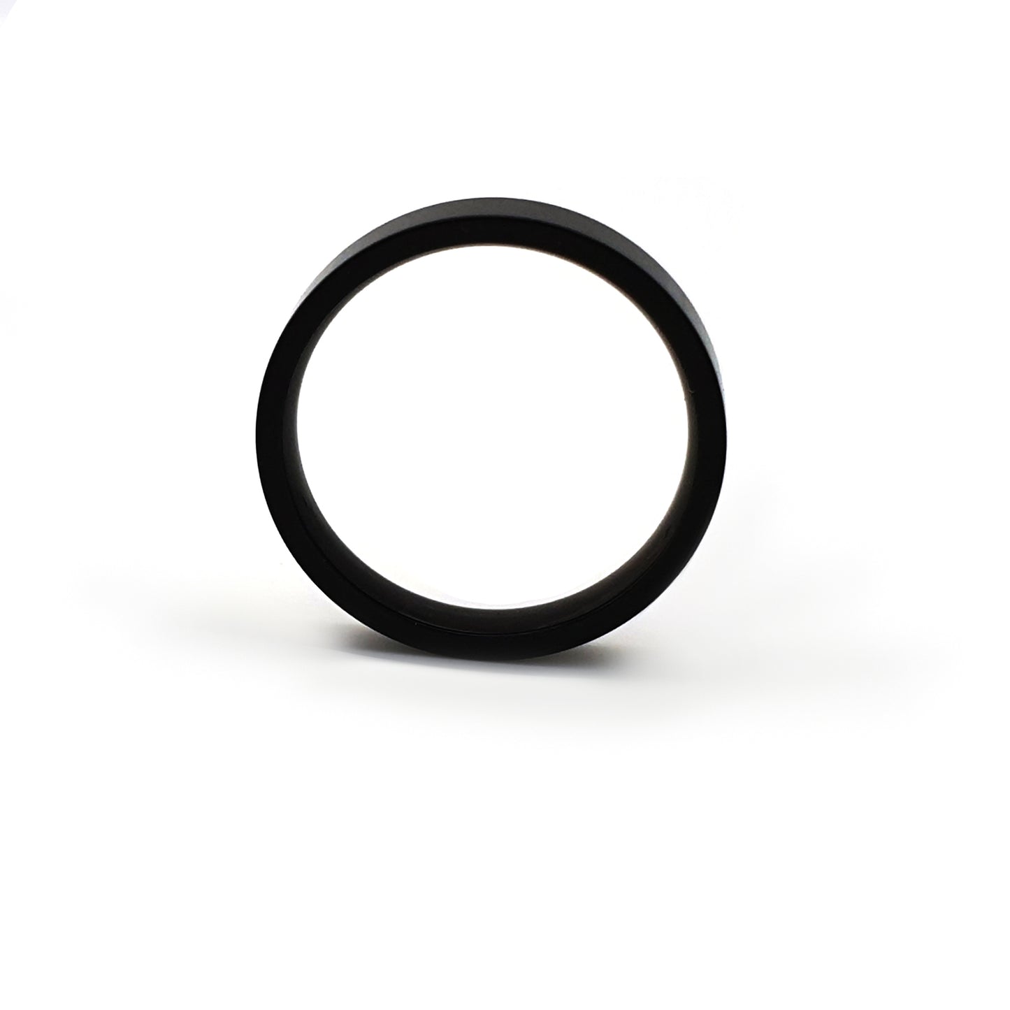 The FR | Art Jewellery Stainless Steel Black 4mm ring features a smooth, polished black finish and a comfortable fit, shown upright against a white background.