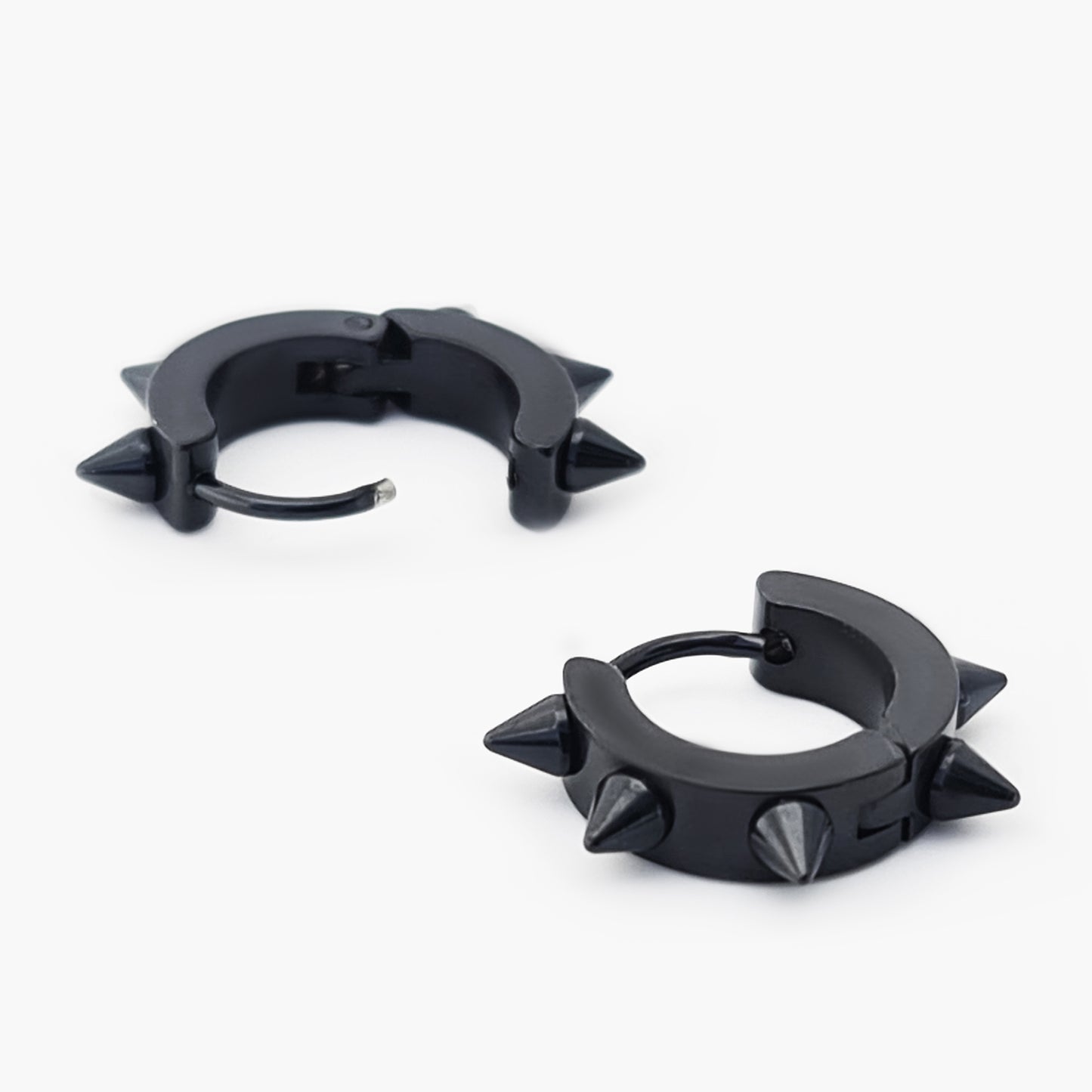 The Punk Stainless Steel earrings by FR | Art Jewellery are black hoops, each adorned with three evenly spaced pointed spikes for a bold, punk-inspired style.