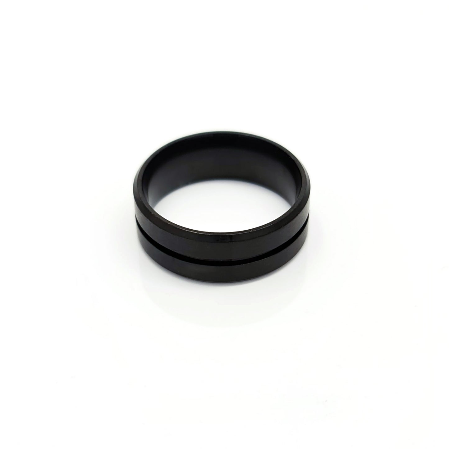 The Stainless Steel Middle Groove ring by FR | Art Jewellery features a black matte satin polished finish, a subtle center groove, and a comfort-fit design, shown on a white background.