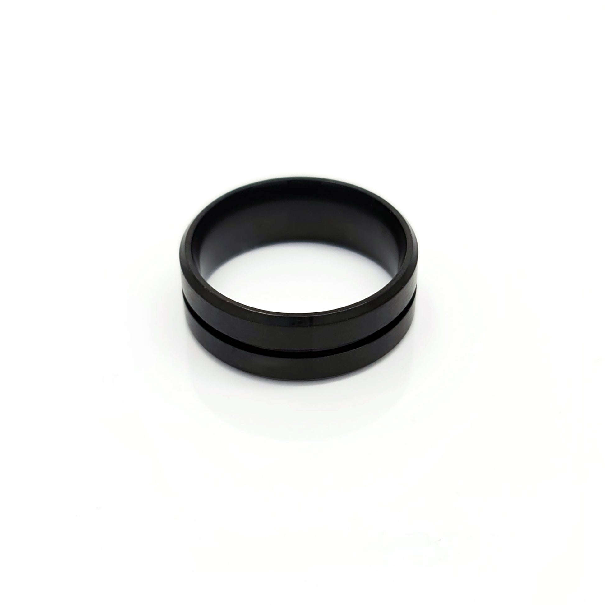 The Stainless Steel Middle Groove ring by FR | Art Jewellery features a black matte satin polished finish, a subtle center groove, and a comfort-fit design, shown on a white background.