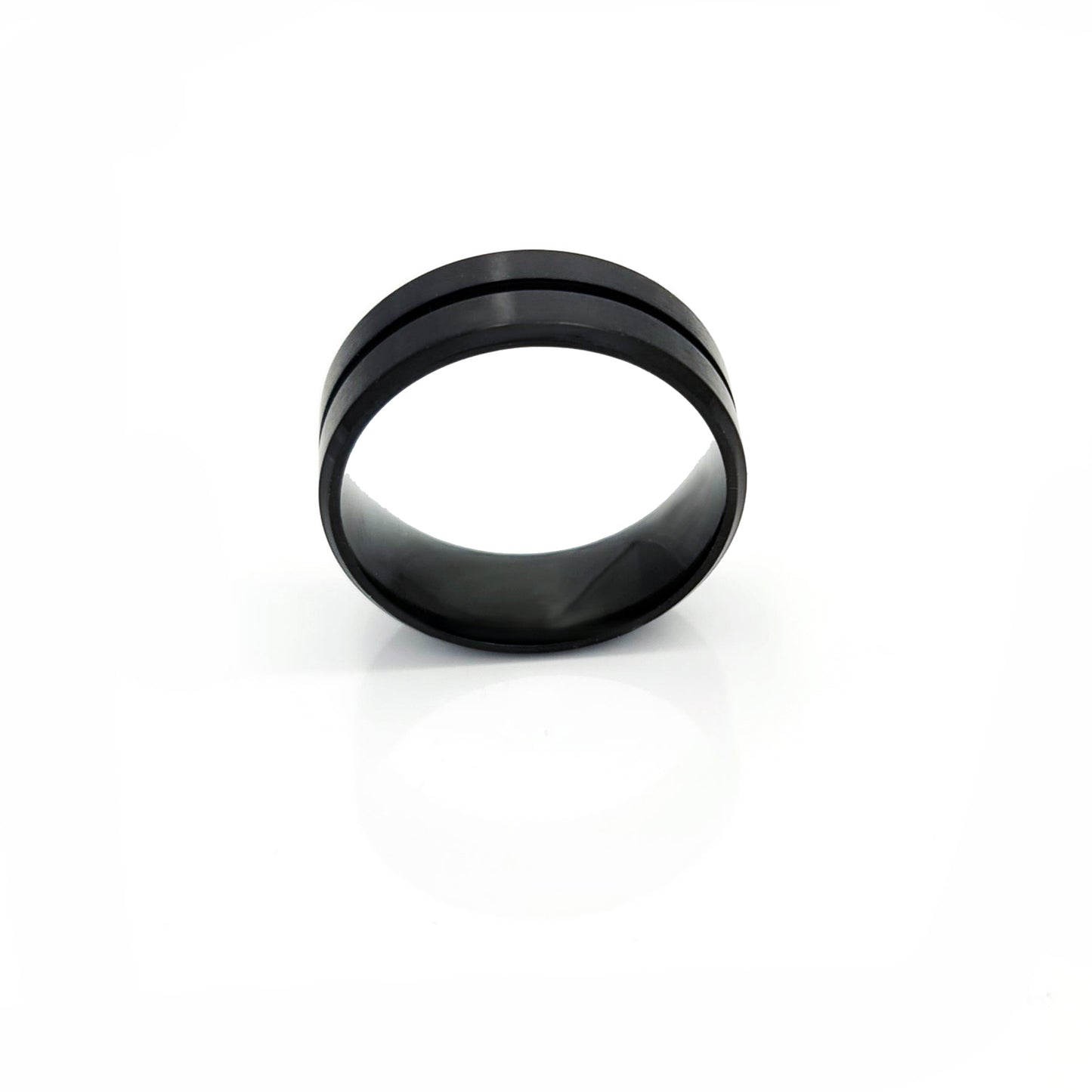 The Stainless Steel Middle Groove ring by FR | Art Jewellery features a black matte satin polished finish, a subtle center groove, and a comfort-fit design, shown on a white background.