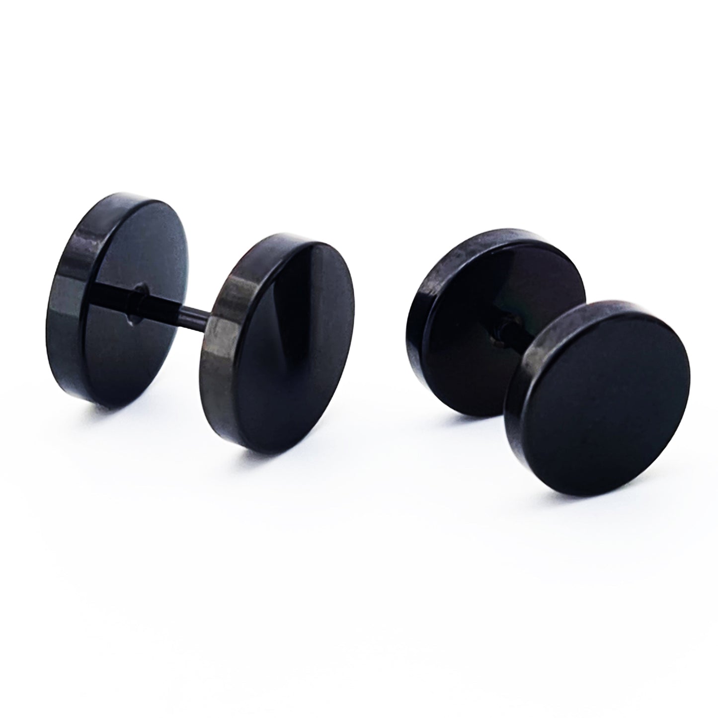 Four Double Stainless Steel Earrings by FR | Art Jewellery, in black unisex style, are arranged on a plain white background—two upright and two lying flat.