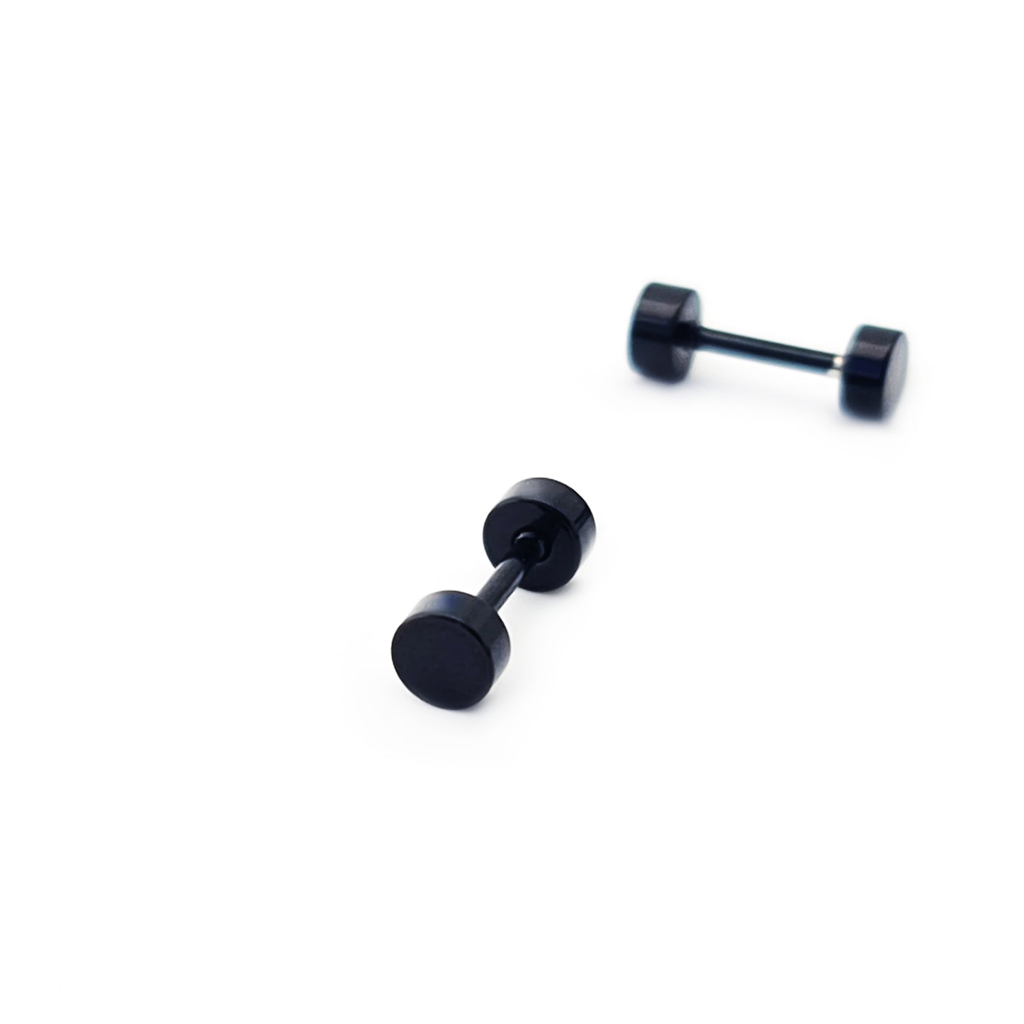 Four Double Stainless Steel Earrings by FR | Art Jewellery, in black unisex style, are arranged on a plain white background—two upright and two lying flat.