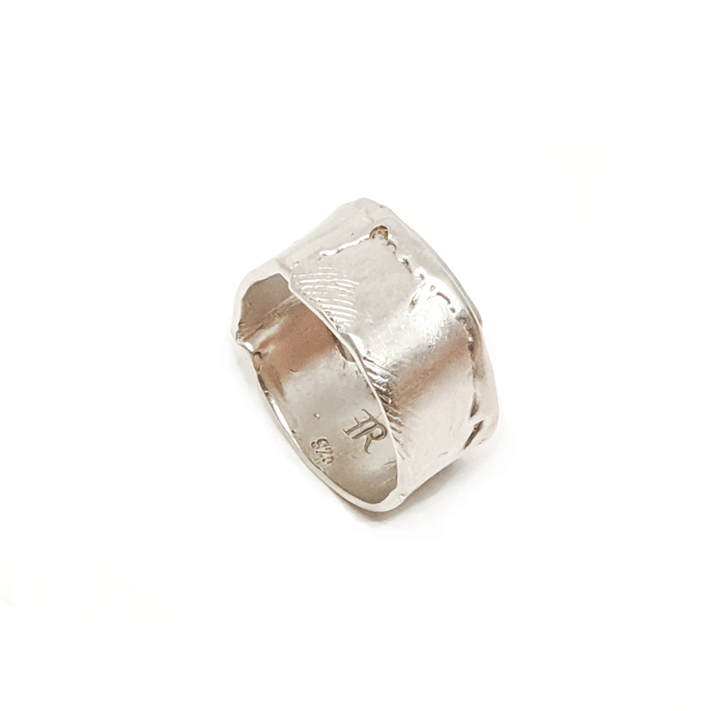 The Sterling Silver Spirel Ring by FR | Art Jewellery features a wide, oxidised band with a wavy textured surface and a visible fingerprint, giving this handcrafted piece an organic, one-of-a-kind look.