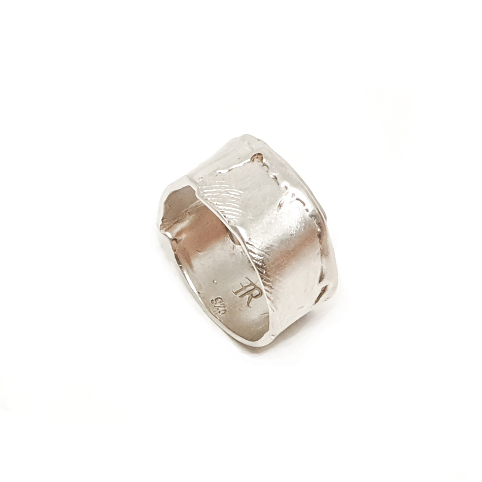 The Sterling Silver Spirel Ring by FR | Art Jewellery features a wide, oxidised band with a wavy textured surface and a visible fingerprint, giving this handcrafted piece an organic, one-of-a-kind look.