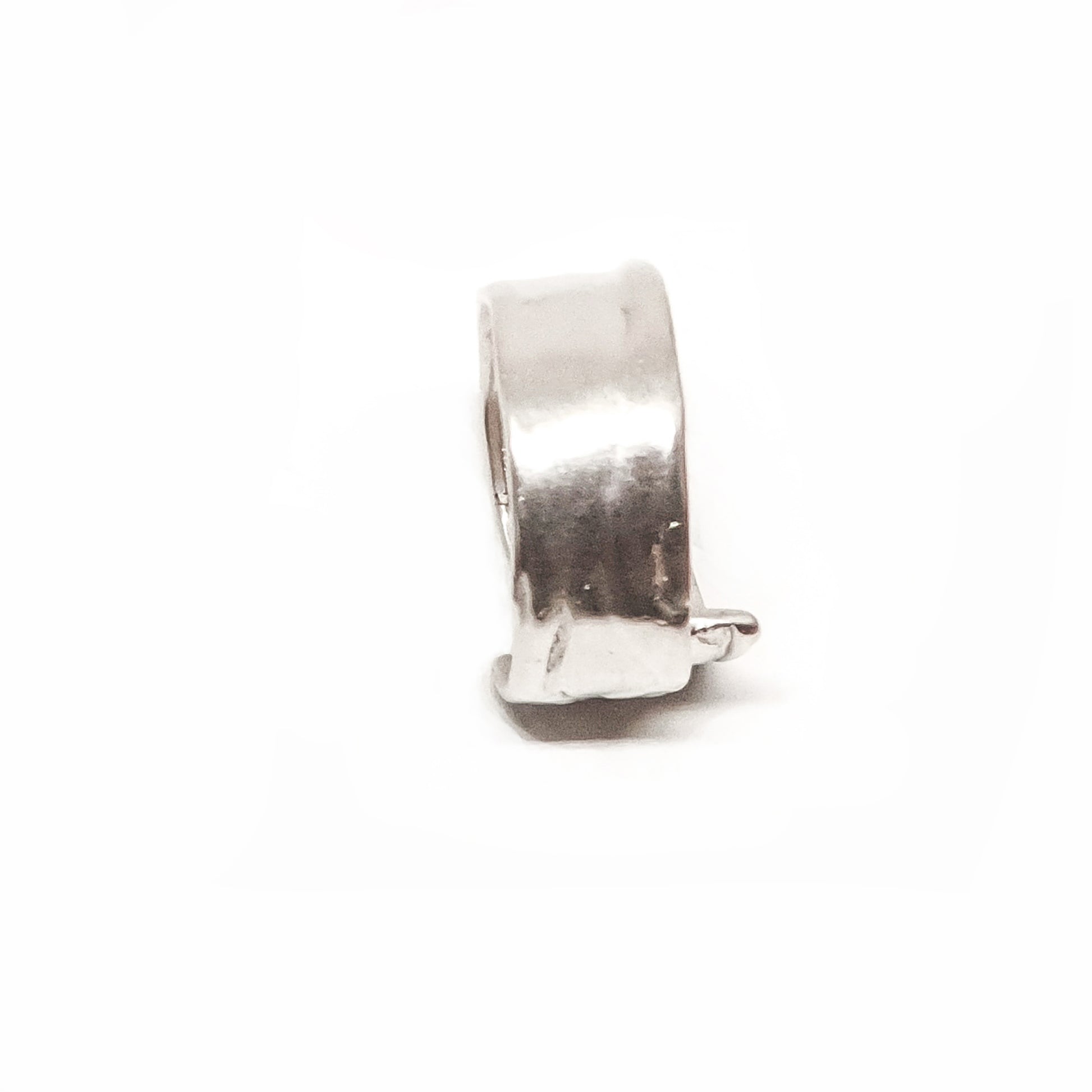 The Sterling Silver Spirel Ring by FR | Art Jewellery features a wide, oxidised band with a wavy textured surface and a visible fingerprint, giving this handcrafted piece an organic, one-of-a-kind look.