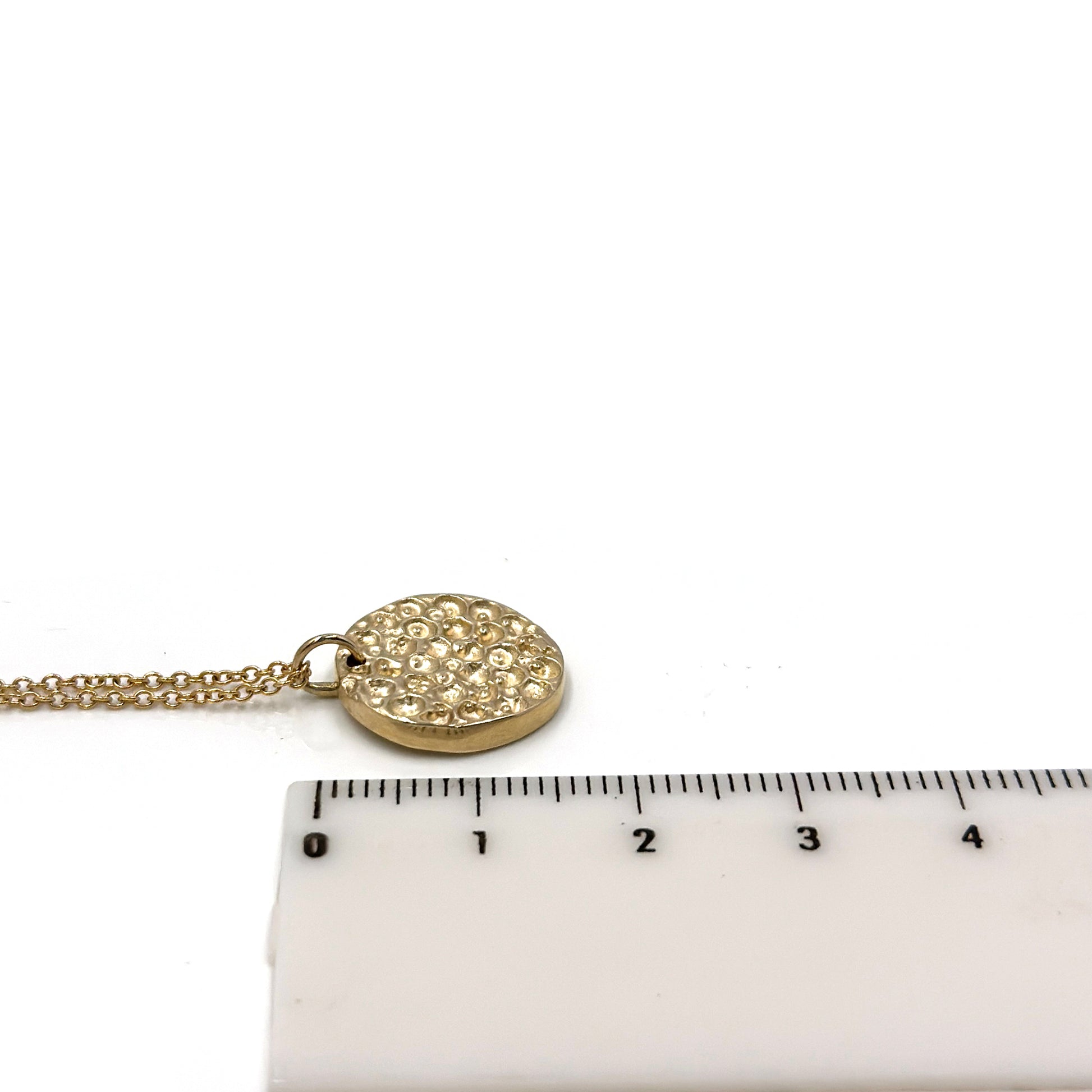 9ct yellow gold necklace has a circular design about 12mm length, and one side it is textured light to wear.