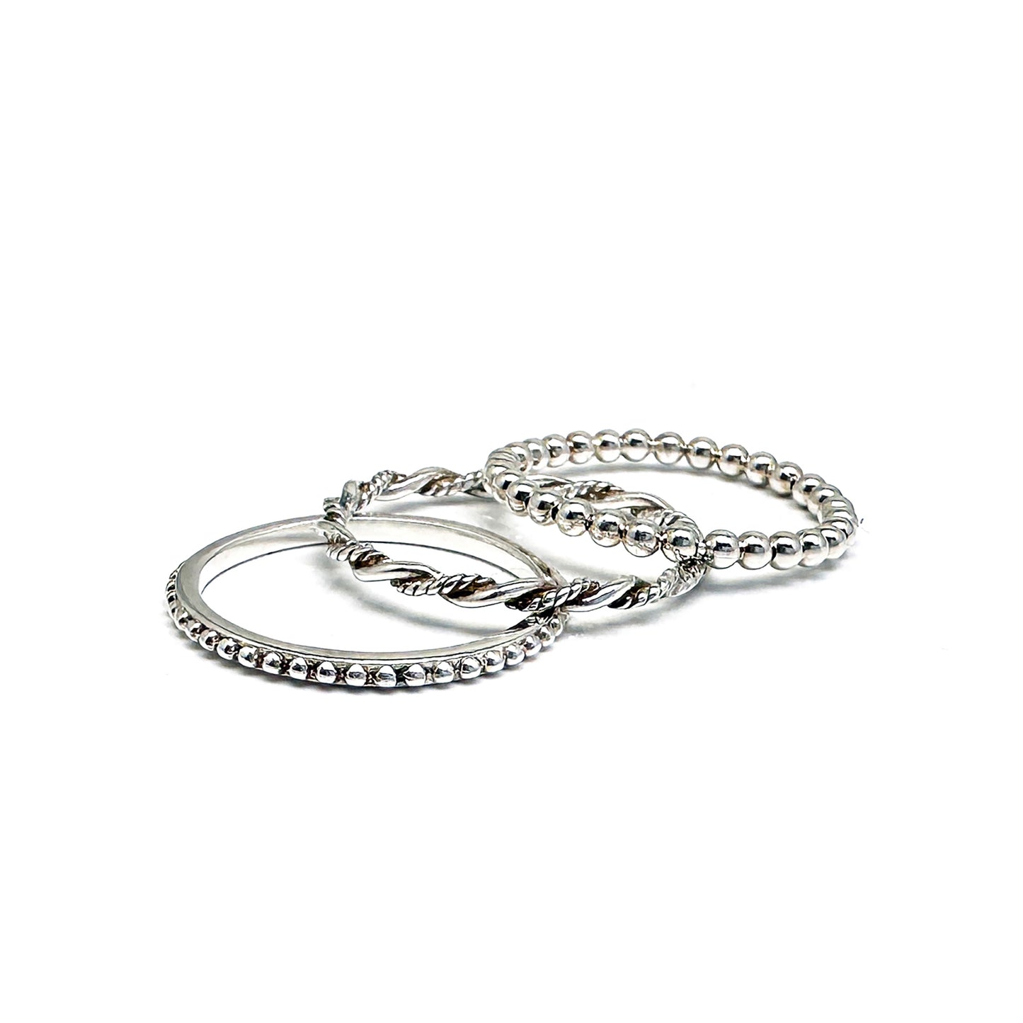 The FR | Art Jewellery Stackable Dot Ring features a single row of small, round silver beads uniformly arranged. The ring is elegantly displayed against a plain white background.