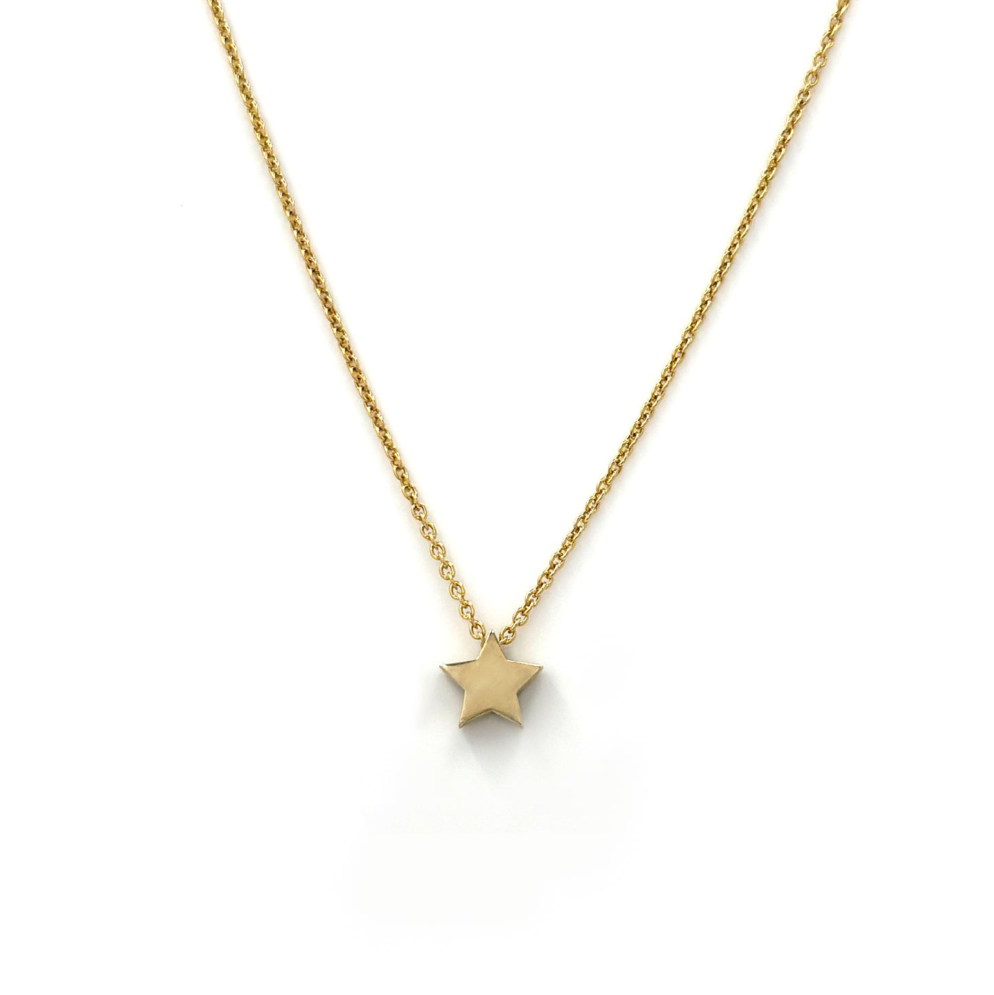 Introducing the Star Necklace by FR | Art Jewellery: This delicate gold chain necklace showcases a small, polished gold star pendant. The chain boasts a simple, elegant design with tightly linked segments. As a handmade piece of jewellery, it exudes minimalist charm with the star pendant beautifully centered against a plain white background.