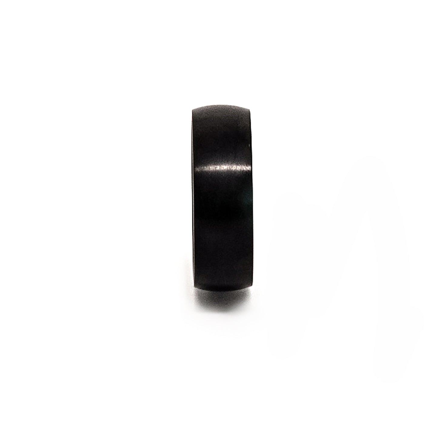 The Titanium Black Ring by FR | Art Jewellery is a comfort-fit titanium band with a black matte finish, shown upright on a white background and engraved with "TITANIUM" inside.