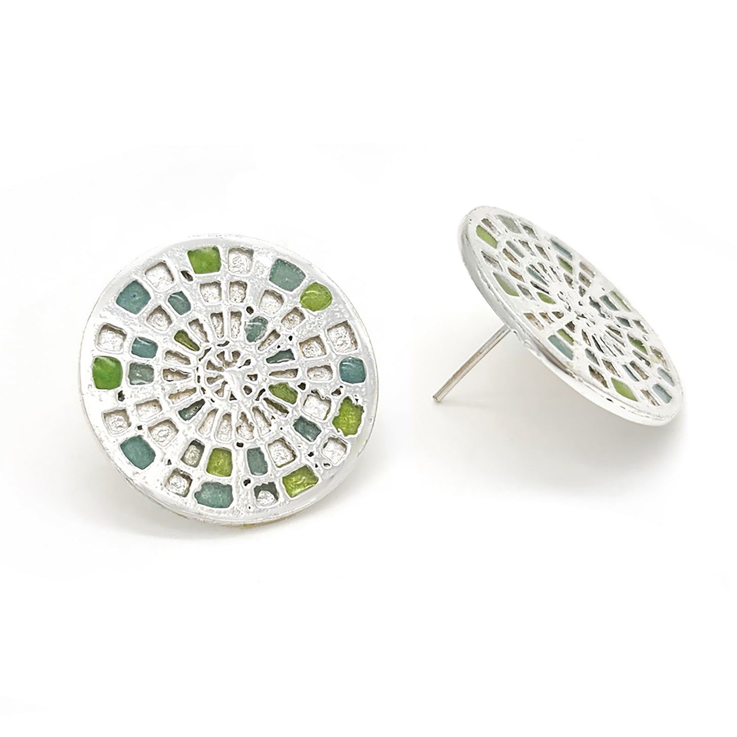 Introducing the Talis Earrings by FR | Art Jewellery, a stunning pair of round stud earrings designed with a stained glass window motif. These intricate pieces feature colored segments in shades of blue, green, and yellow, all beautifully set in silver-tone metal. Handmade to perfection, one earring is displayed front-on while the other is subtly angled.