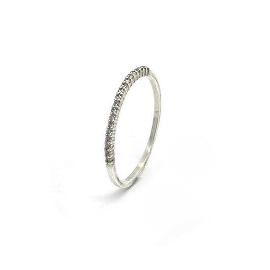 The Tiny Eter Ring (Quartz) by FR | Art Jewellery features a delicate silver pavé band with small clear stones along the top half, ideal for stacking or as elegant daily wear, shown on a white background.