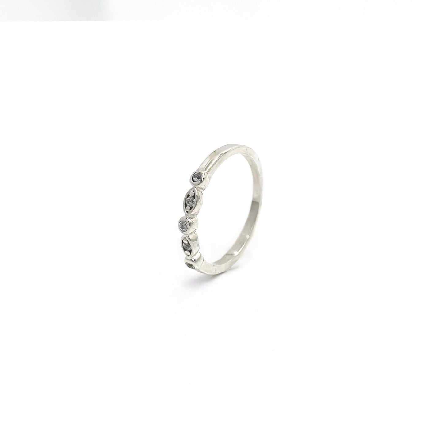 The Tiny Crown Ring (Quartz) by FR | Art Jewellery features a delicate silver crown design with four round quartz stones in marquise settings, shown on a white background. Perfect for Christmas gifts.