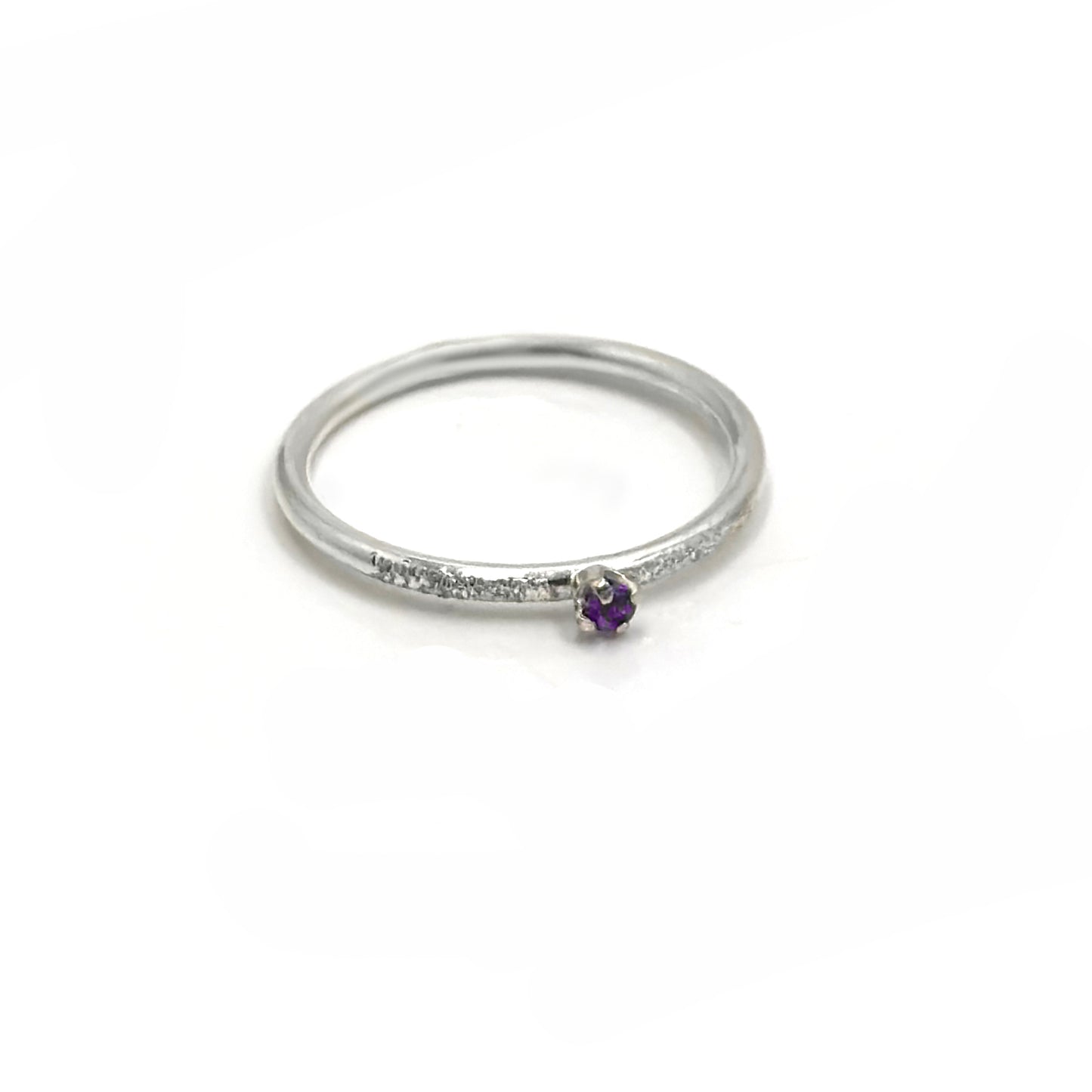 The Tinytoo Sterling Silver twisted Ring with Amethyst Gemstone by FR | Art Jewellery features a minimalist design—perfect for everyday elegance and beautifully displayed on a white background.