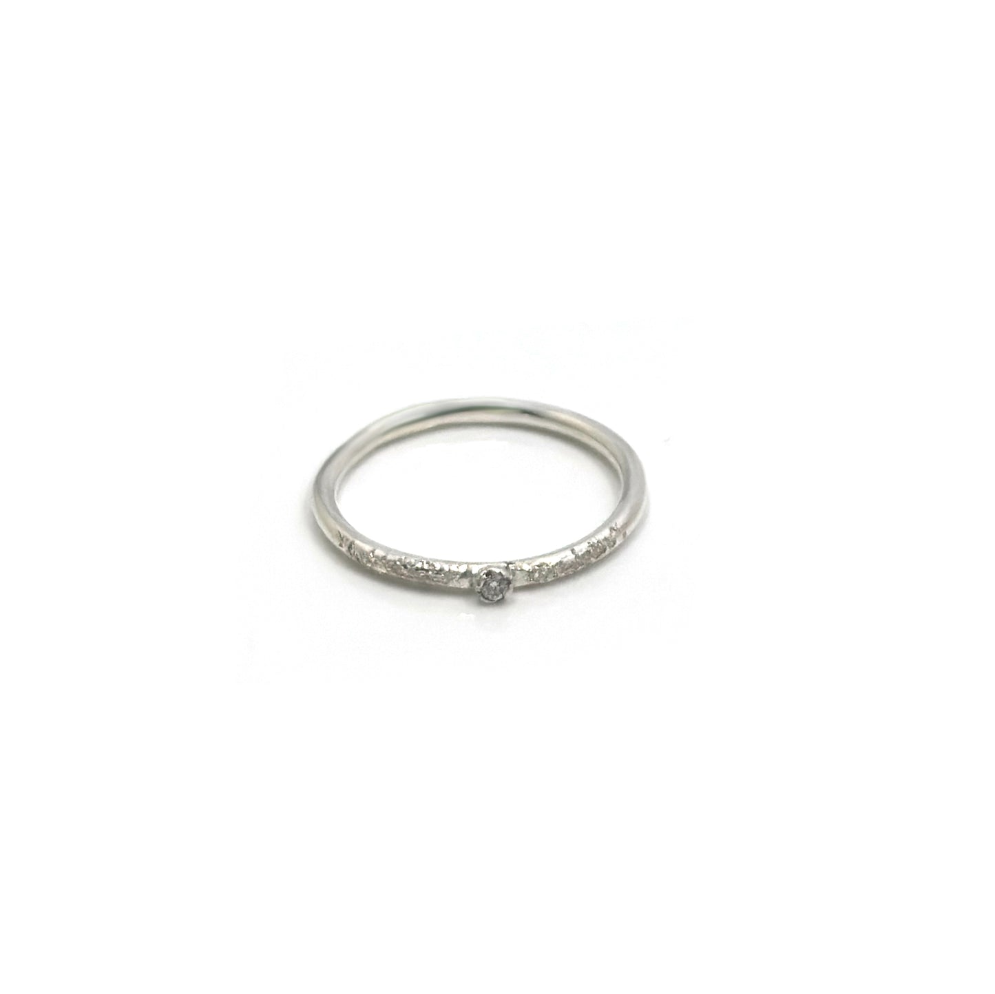 The Tinytoo Sterling Silver Ring with Diamond Gemstone by FR | Art Jewellery features a small central diamond and tiny diamonds on the band, shown against a plain white background.