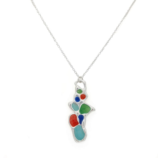 A silver chain necklace from FR | Art Jewellery, the Vitro Colours Necklace features a colorful abstract pendant with irregularly shaped sections in vibrant hues including red, green, blue, and turquoise.