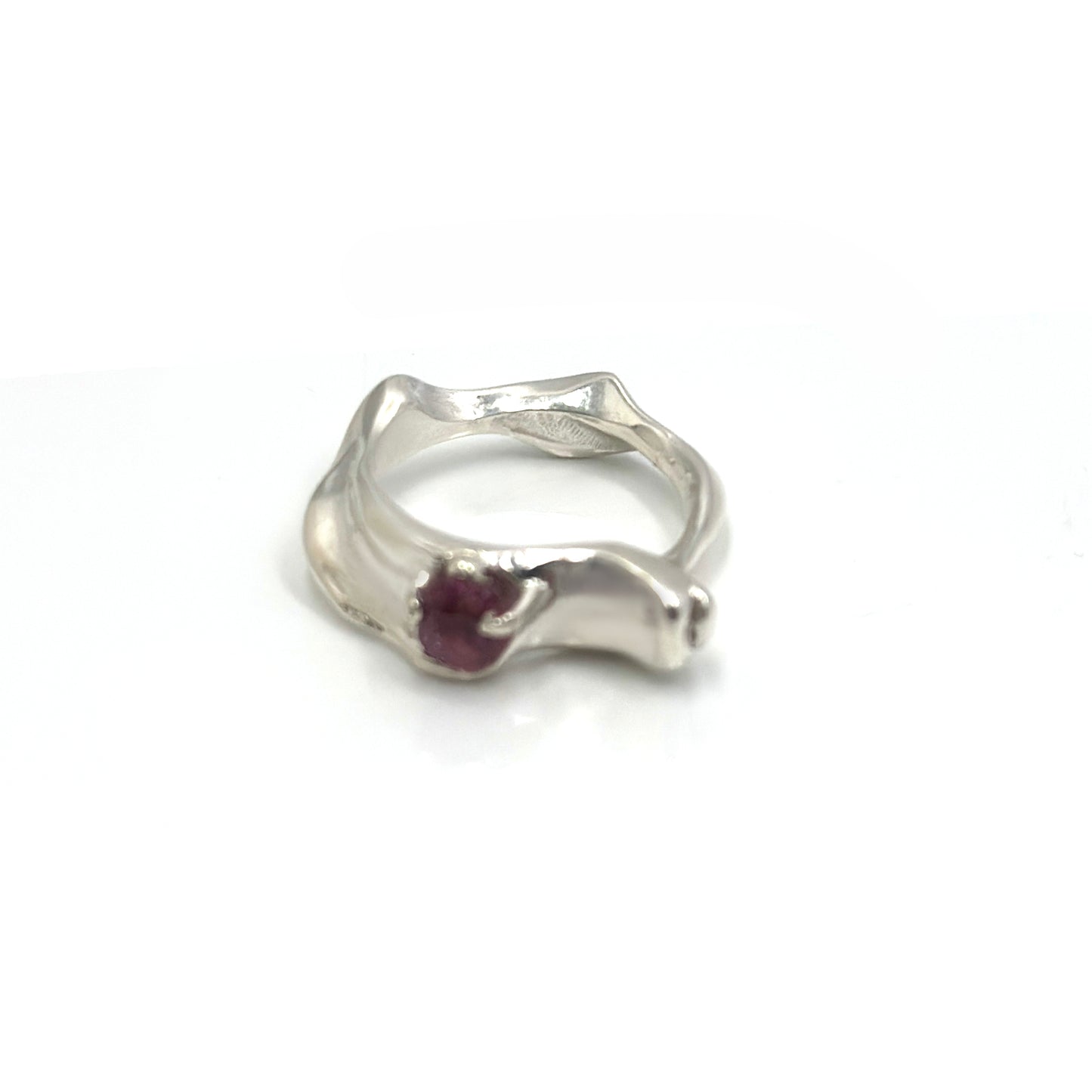 Handmade sterling silver sculptural Water Ring with pink-red spinel gemstone, wave-inspired organic design three.