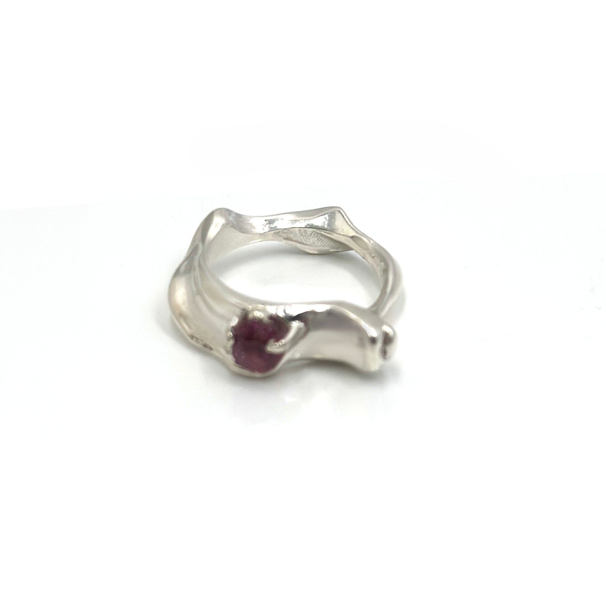 Handmade sterling silver sculptural Water Ring with pink-red spinel gemstone, wave-inspired organic design three.