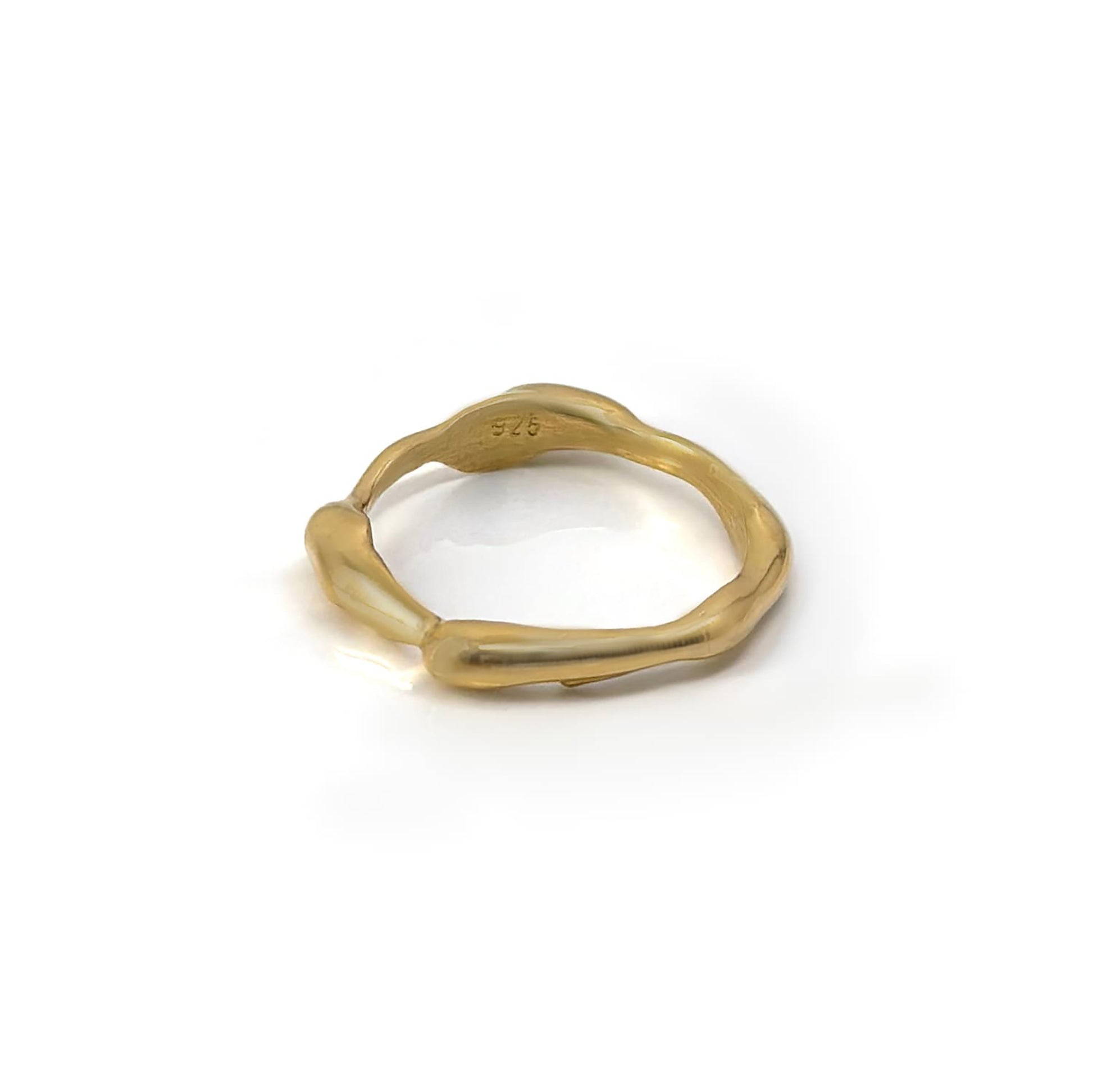 The Freedom Ring by FR | Art Jewellery showcases a captivating gold design with an irregular, organic shape and small bulbous protrusions around the band. This unique piece features an artisanal aesthetic set against a plain white background.